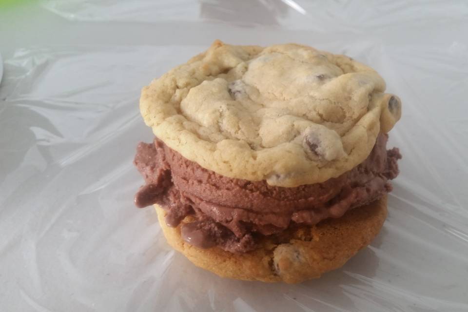 Homemade chipwich sandwich with chocolate ice cream.