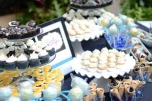 Buff & Blue Dessert Table:  Mini Blue Velvet Cupcakes, Mini triple Salted Caramel Cupcakes, Mini Lilikoi (passion fruit) cheesecakes, Buff & Blue cake pops, Chocolate Covered Strawberries, Mini Cookie Cones lined with chocolate & filled with pastry cream & organic blueberries, Mini Oreo Cheesecakes topped with ganache