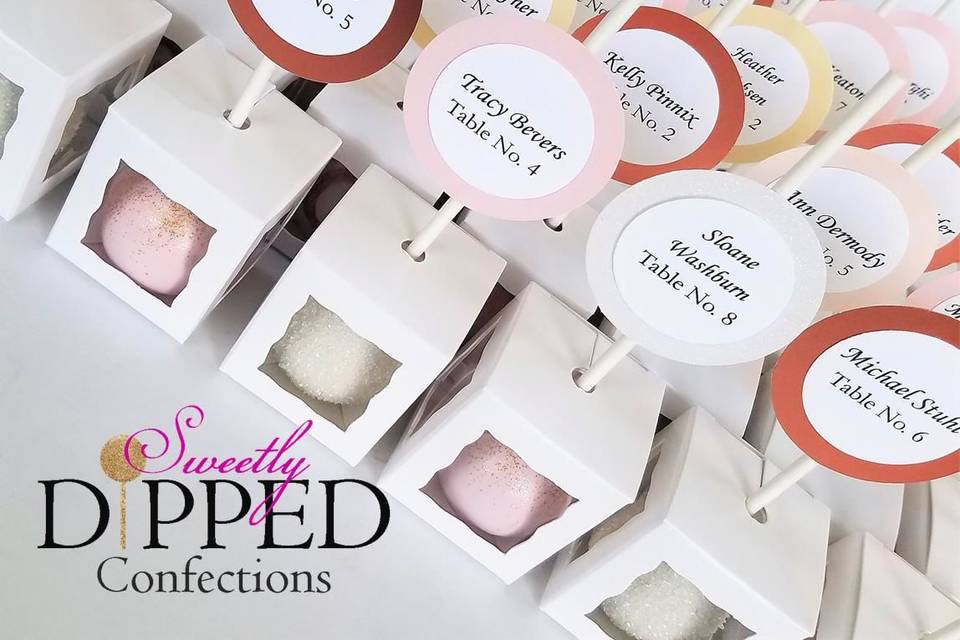 Individually boxed escort card cake pops