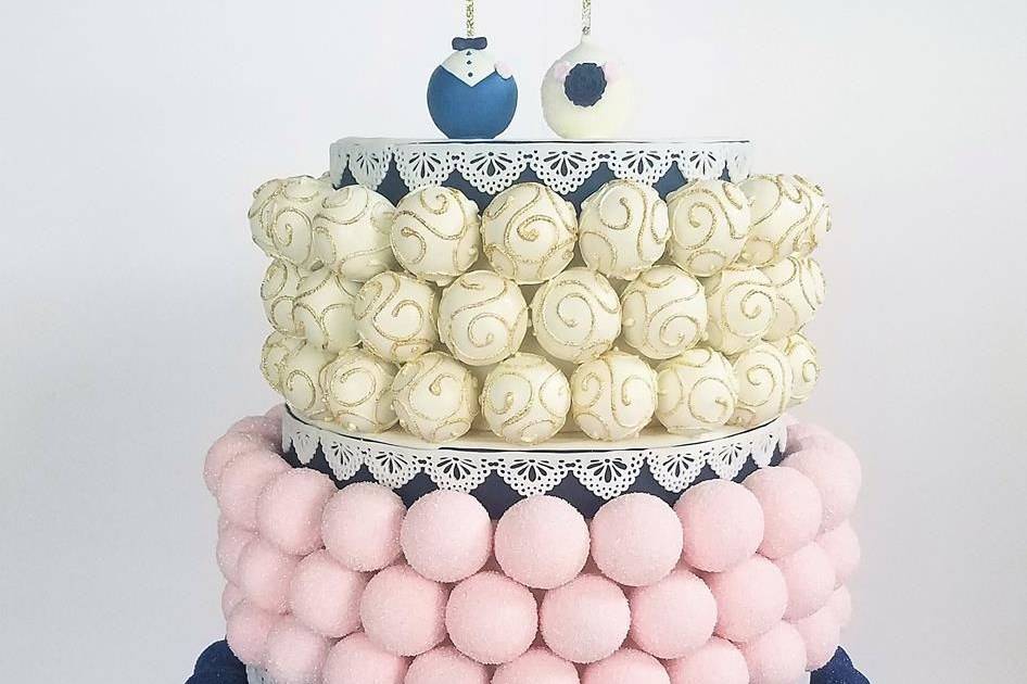 Blush, navy, white, and gold cake pop cake