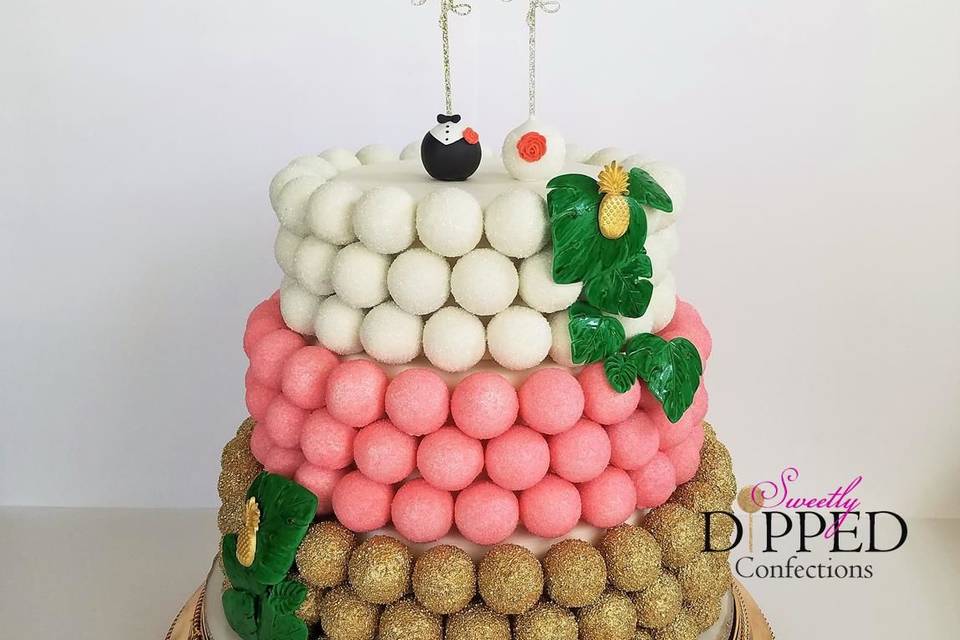 Tropical gold, coral, and white cake pop cake