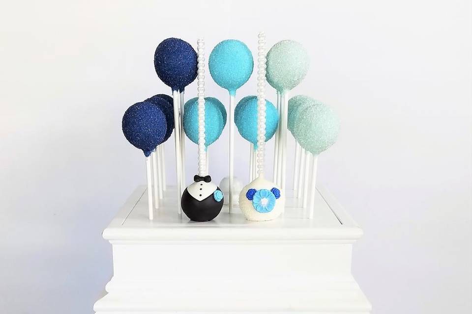 Blush, navy, white, and gold cake pop cake