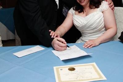 Felicia & Mathias signing their Marriage Certificate