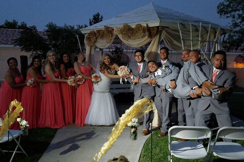 The couple with the bridesmaids and groomsmen