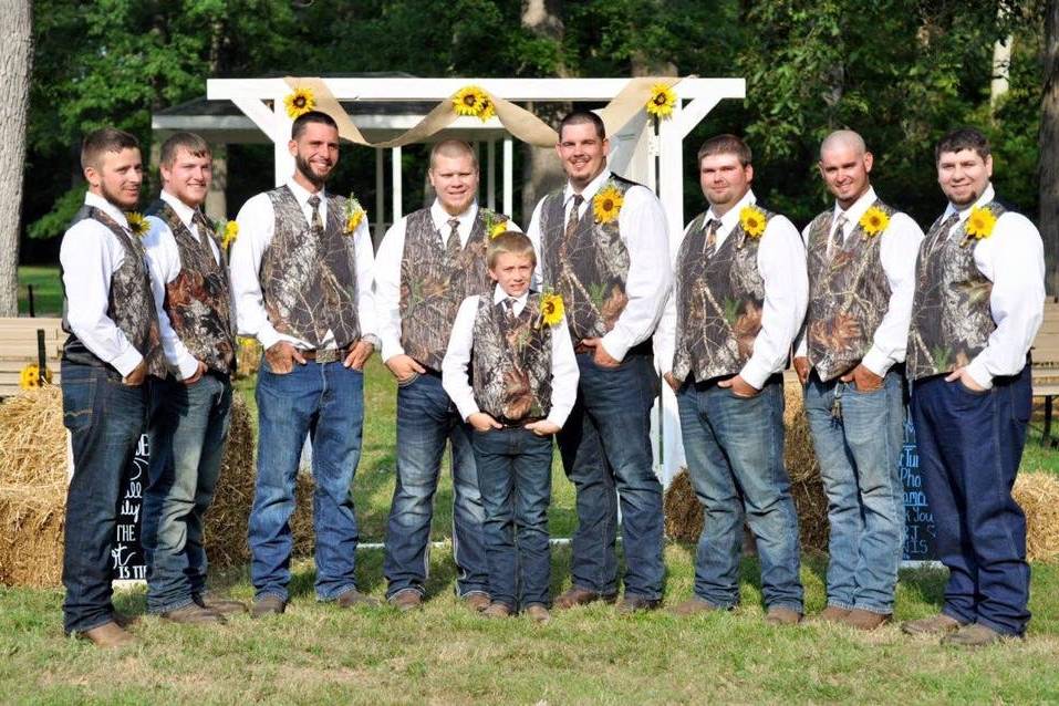 Groom is wearing a tan suit