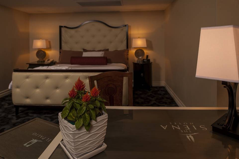 Junior Suite with king bed,  Juliet Balcony, large marble bathroom, and sitting area.