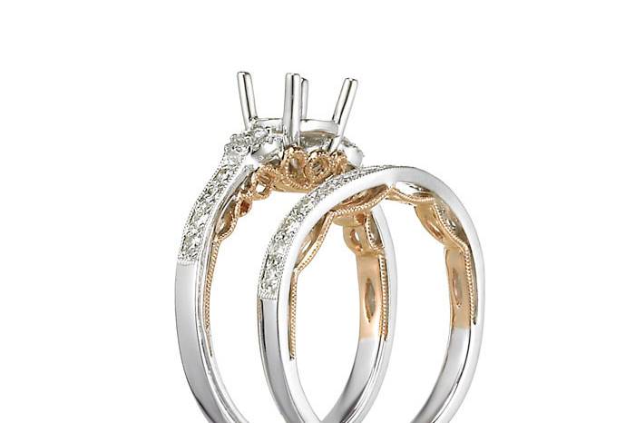 KTD's exclusive Sabrelle Collection of engagement and wedding rings feature 18-karat white gold and a distinctive 18-karat rose gold trellis on each ring. Not exactly your style? Let us design a ring for you.110-01087, 140-03319