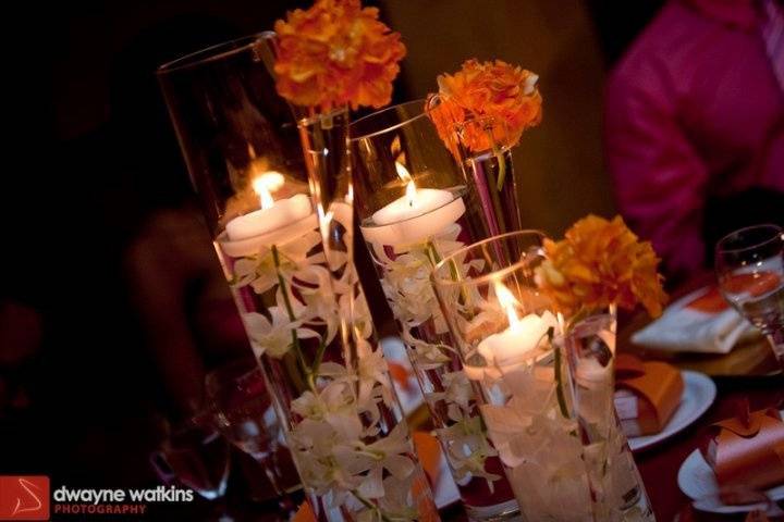 Cylindrical vases with a punch of tangerine. Great & affordable centerpiece