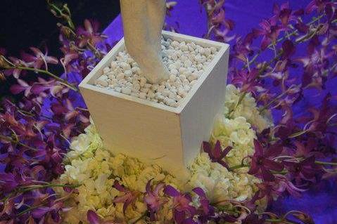 Base of a white tree centerpiece, quite an elaborate centerpiece. Purple's the colour!