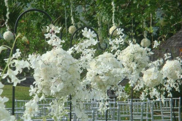 Our pomanders hanging from shepherd hooks made dramatic aisle marker