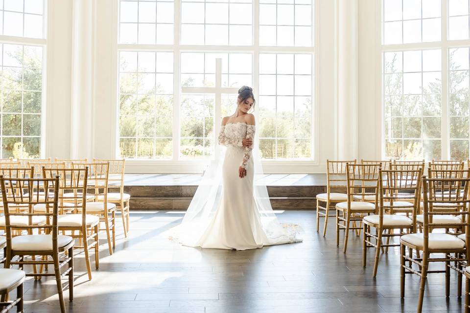 Bride posing in chapel