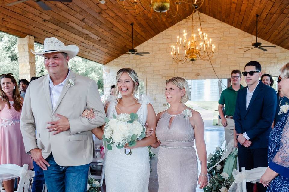 Bride bring walked down