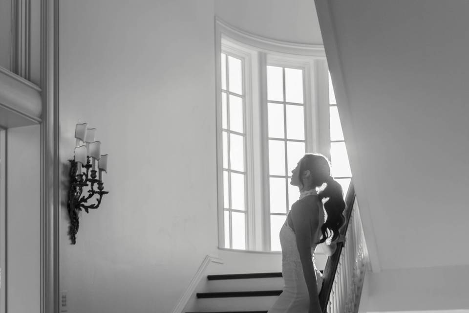 Bride posing on staircase