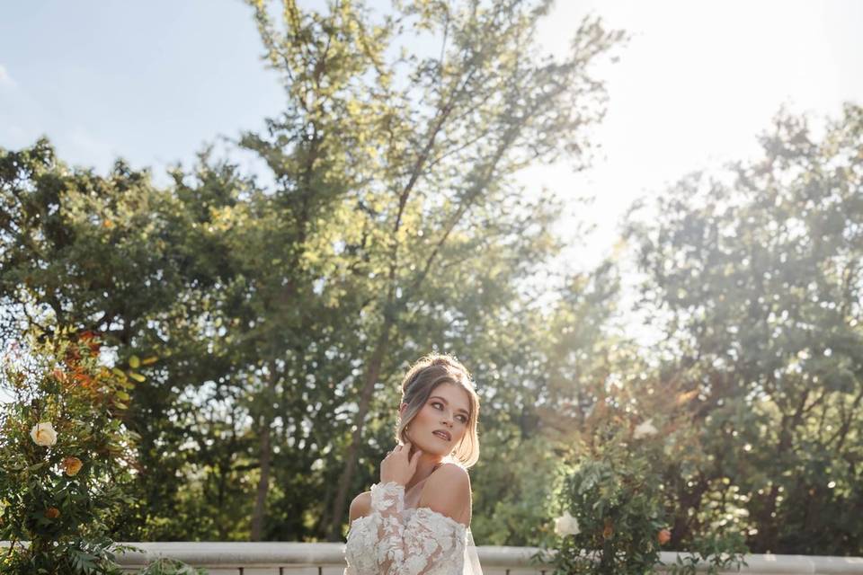 Bride posing with florals