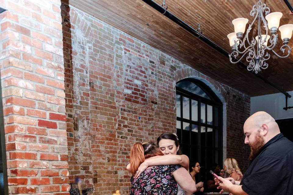 Bride hugging a guest