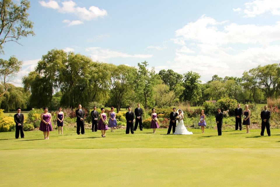 The couple with the bridesmaids and groomsmen