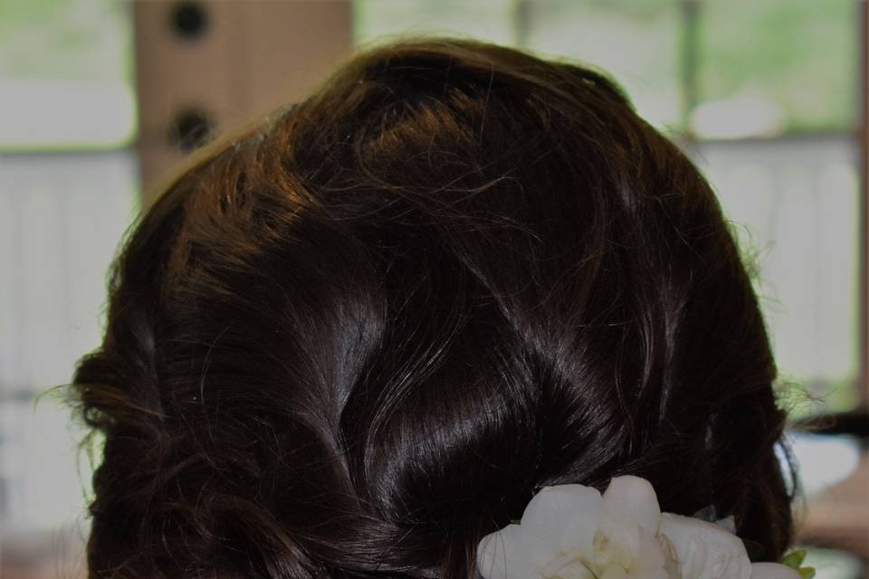 Updo with floral hair accessories