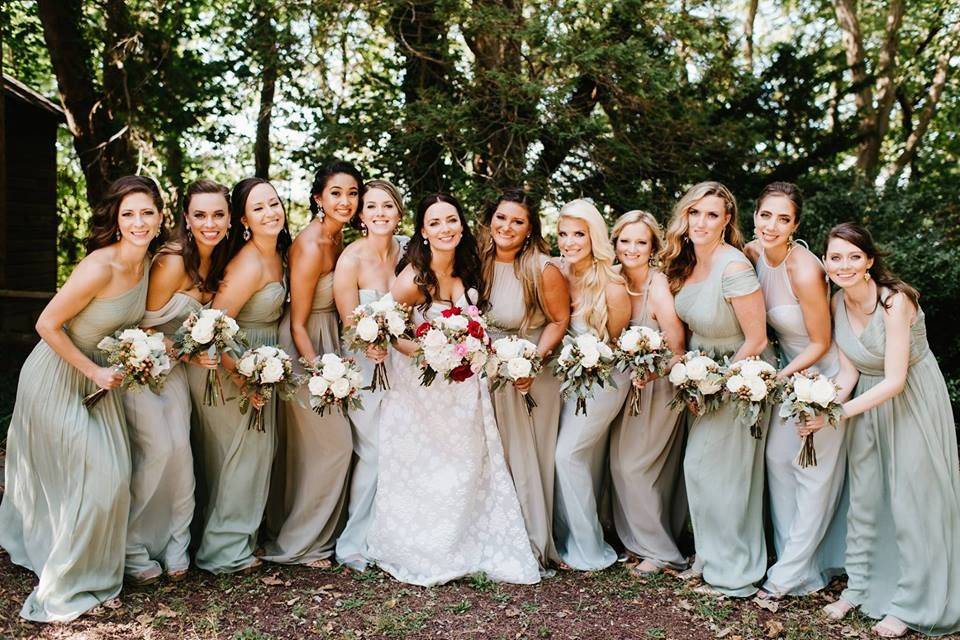 The bride posing with the bridesmaids