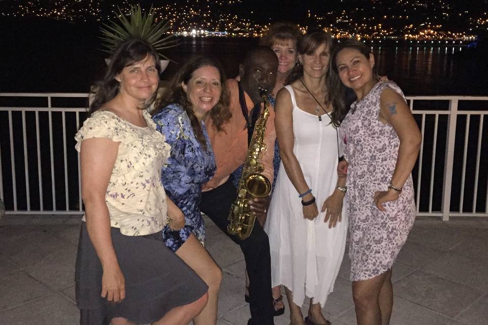 These beautiful ladies and their group enjoyed dancing to Saxophone Serenade music by Clinton during their time on ST. Thomas USVI at the Marriott Resort. St. Thomas harbor is in the background on a very romantic island star filled night!