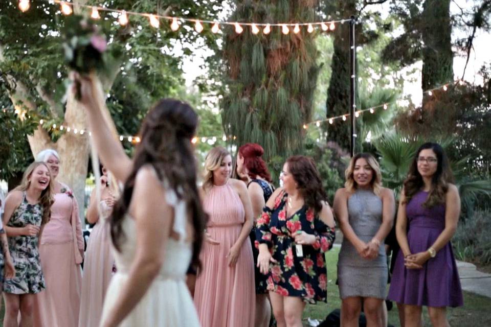 Bride throwing her bouquet