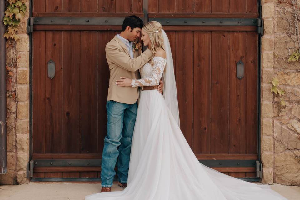 Bride & Groom in front of door