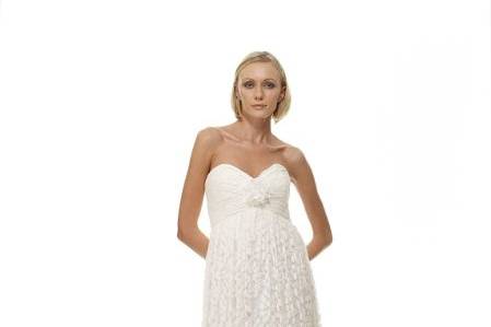 Style B1047 - Front ViewBirch Leaf Cotton Lace Empire Waist Gown w/ Pleated Bodice & Matching Hand-Rolled Daisy - Off-White As Shown. Also Available in White