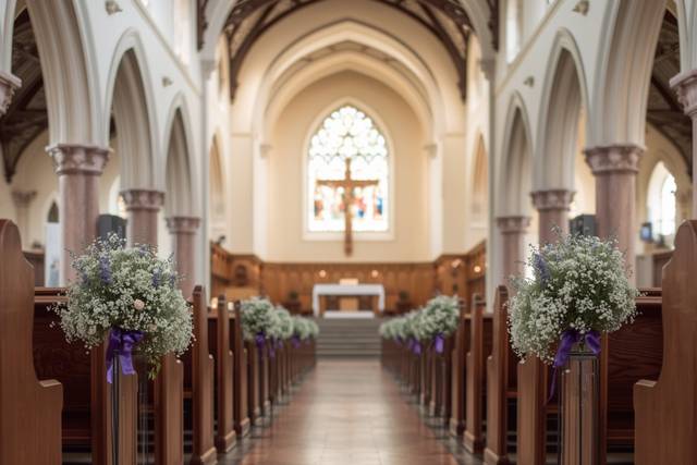 Down-the-aisle view of church interior with low stands of lavender and baby's breath floral arrangements at the end of the pews .jpg