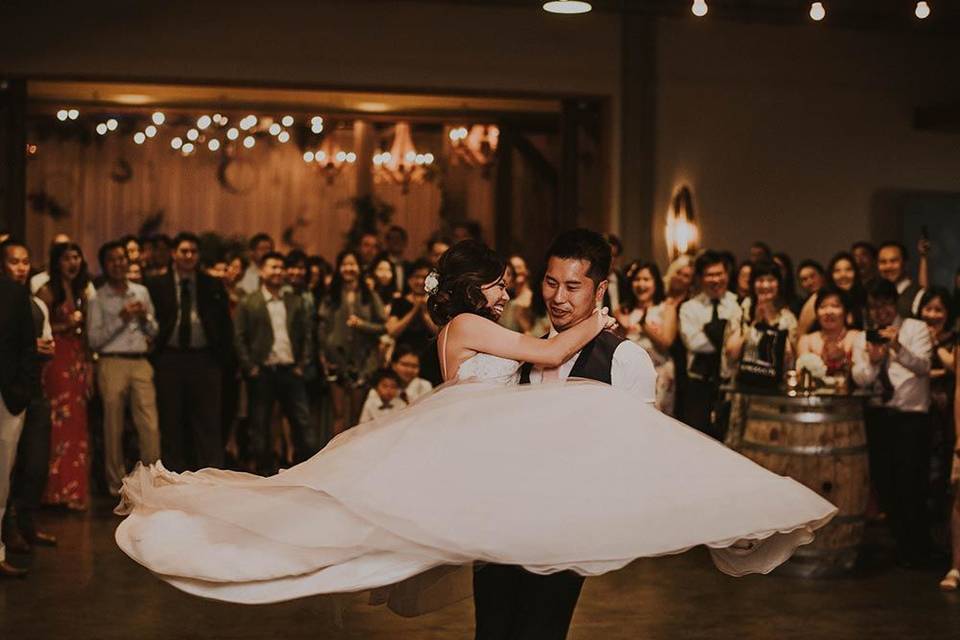 Groom lifting his bride