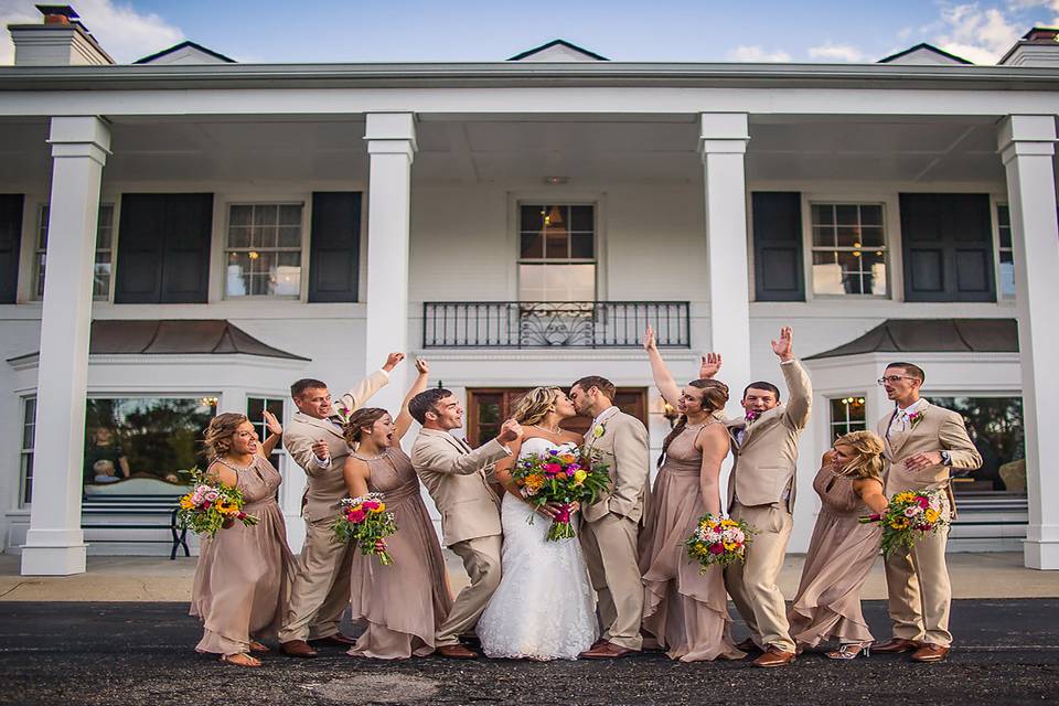 The couple with the bridesmaids and groomsmen