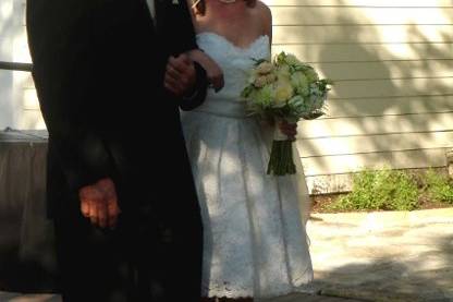 Rebecca and her father walk down the aisle for the ceremony at The Allan House.