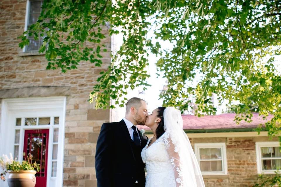 Couple in front of stone house