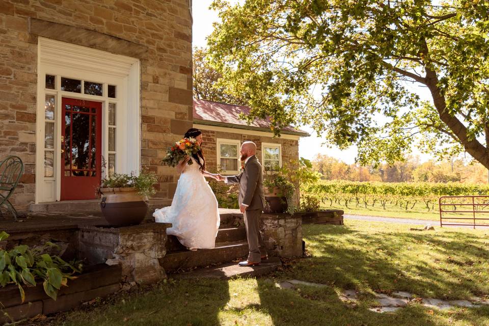Couple in front of stone house