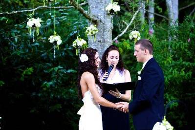 Flowers hanging in tree for ceremony