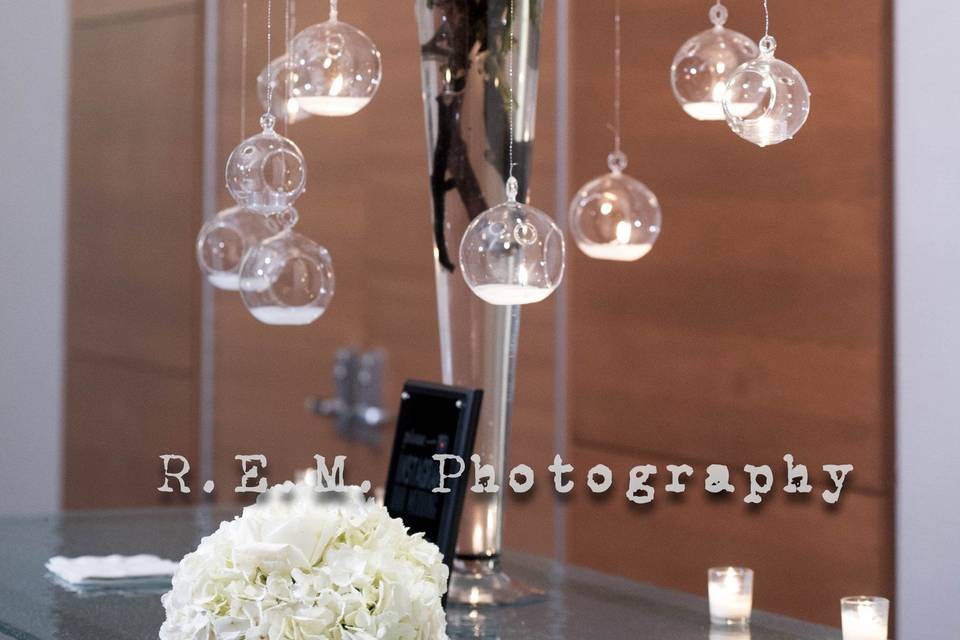 Floral arrangement with hanging decor