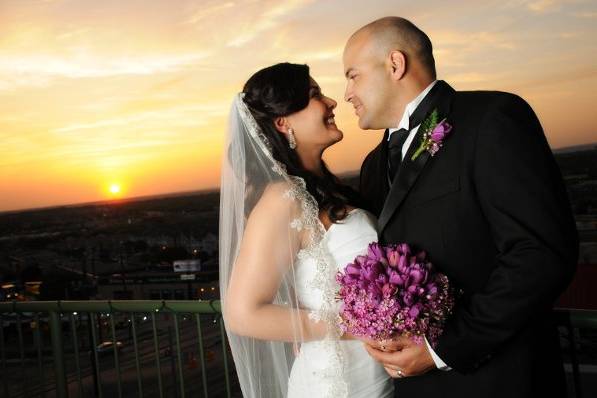 Bride & Groom on balcony. Photo credit: Caitlin's Creations