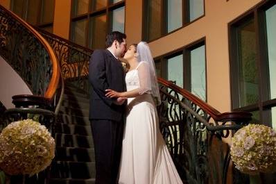 Bride & Groom on staircase. Photo credit: Infinity Photography