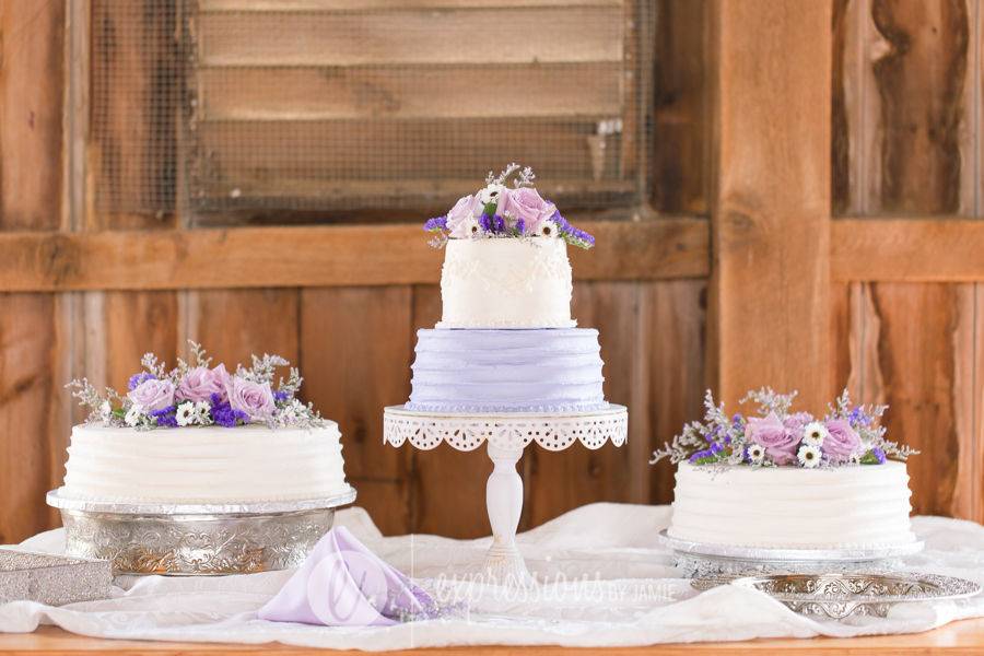 Cake display on our farm table Weddings By Paul V
