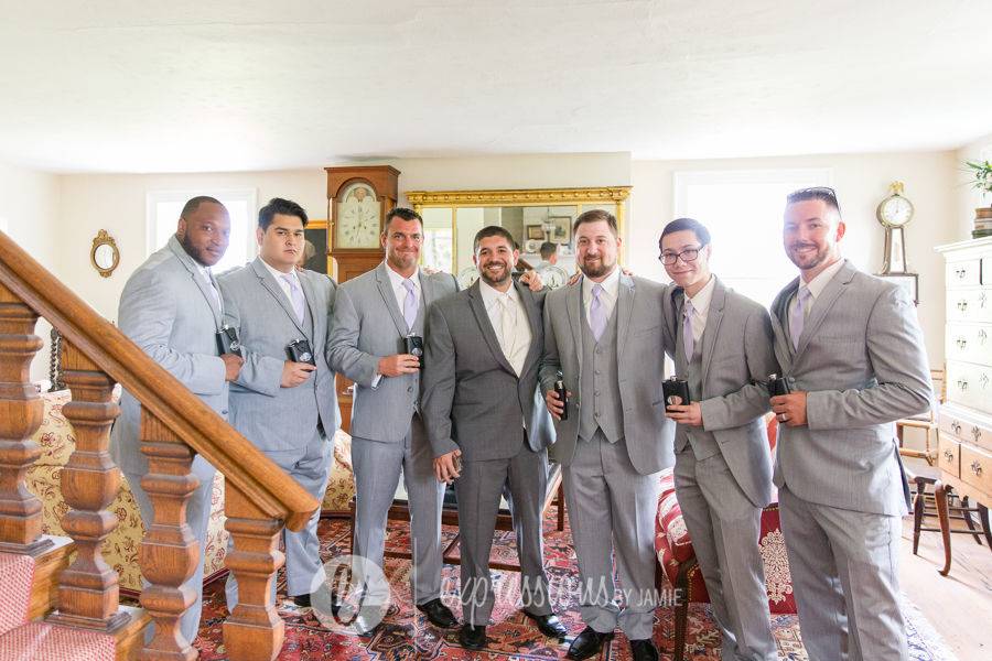 Groomsmen inside the farmhouse