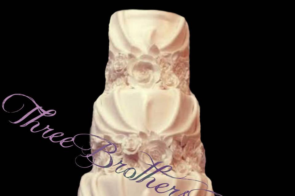 White wedding cake with blue ribbon