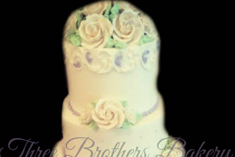 White wedding cake with flowers on top