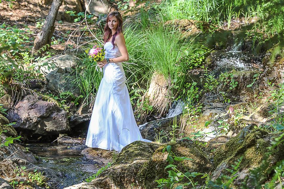 Bride standing in cascades