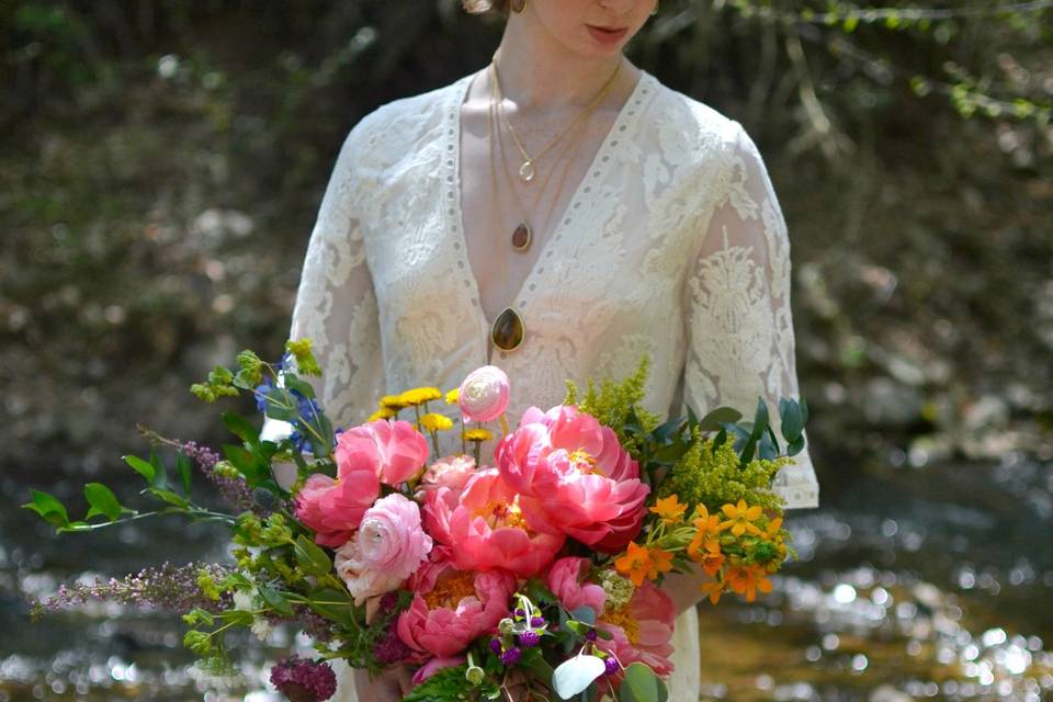 Sleeved wedding dress and bridal bouquet