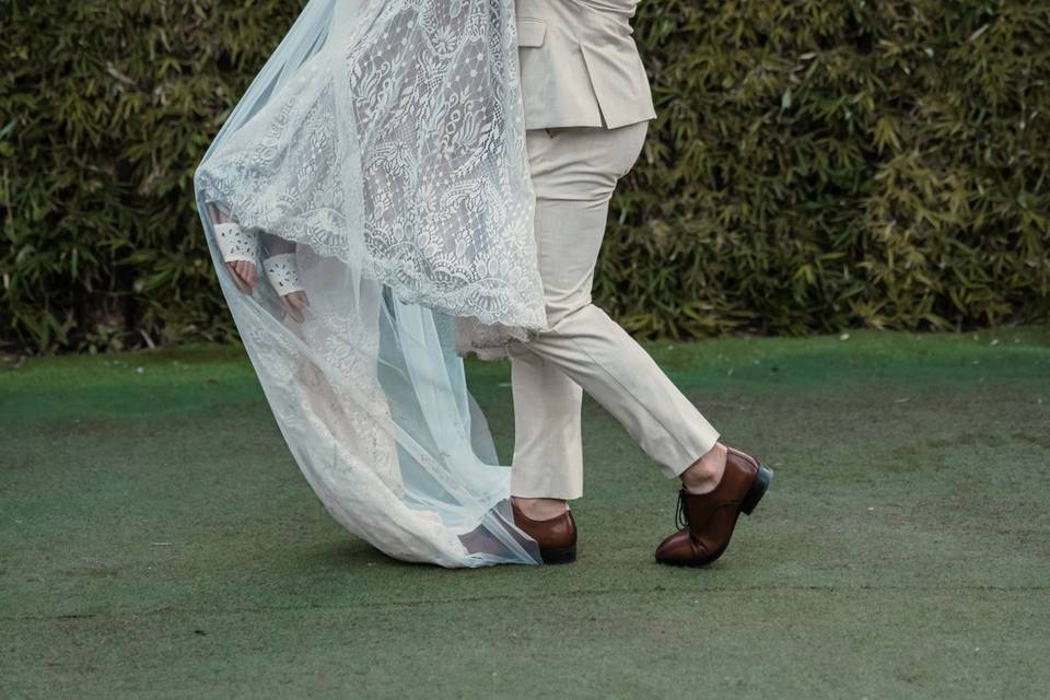Groom carrying bride