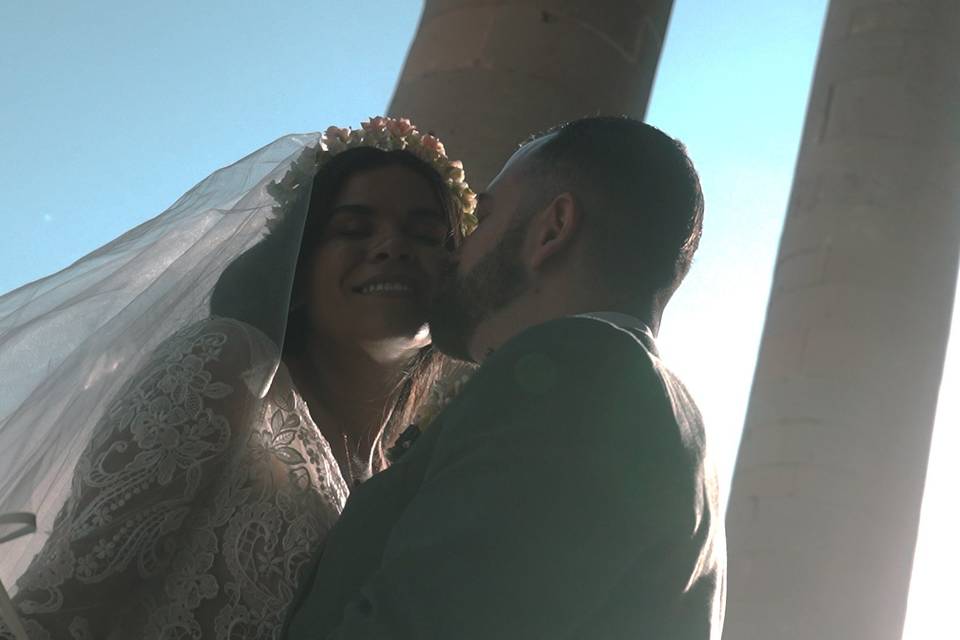 Groom kissing the bride
