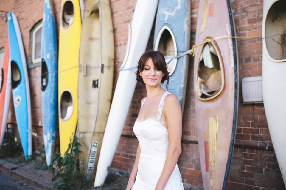 Bride by the canoes