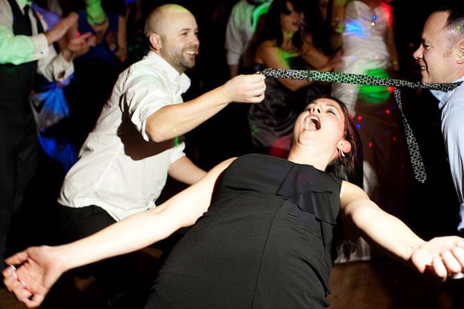 Wedding guests doing the limbo