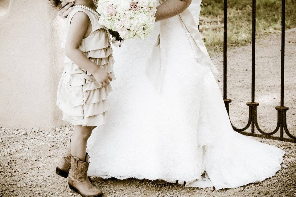 Bride kissing her little girl