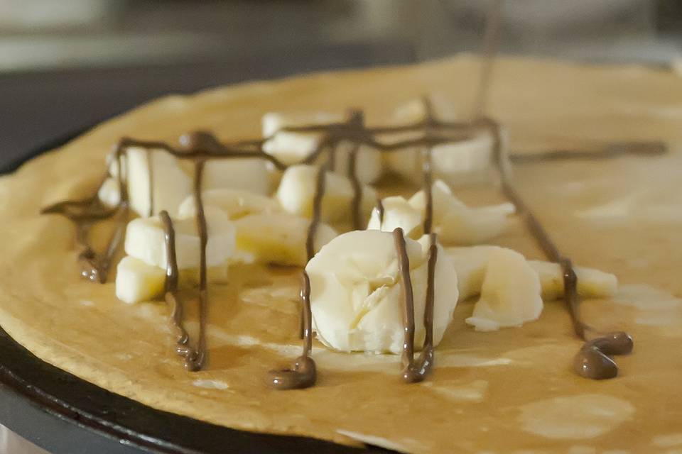Banana Nutella crepes prepared by a chef on site at your event. A fun action station.