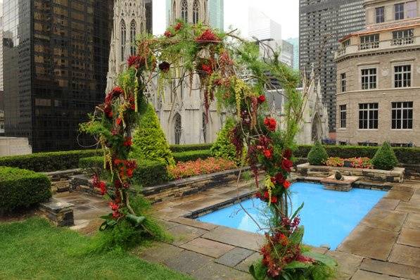 Wysteria vines, amaranthus, roses and orchids were used to frame the ceremony at Rockefeller Center.
