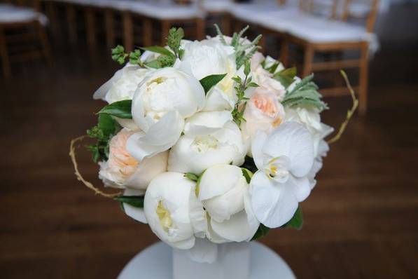 Voluptuous and fragrant is the combination of white garden roses, peonies and phaleanopsis.